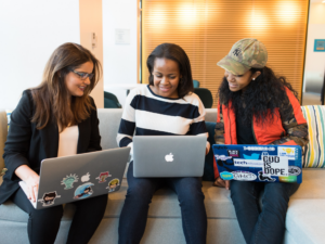 3 women filling out blackrock applications on their computer